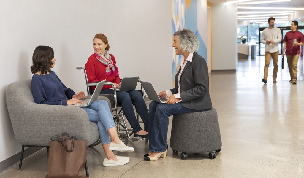 Three CSAA employees collaborating together